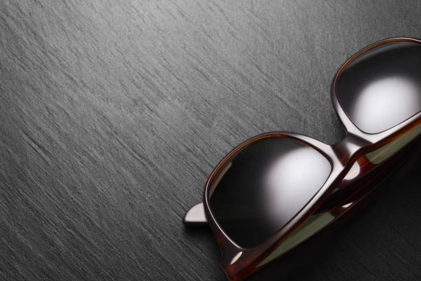 istock Classic sunglasses on black slate background 1176463695