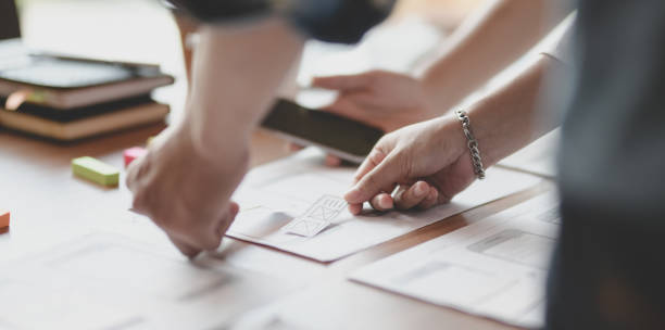istock Young passionate UX web designer team planing their interface project together 1176469758