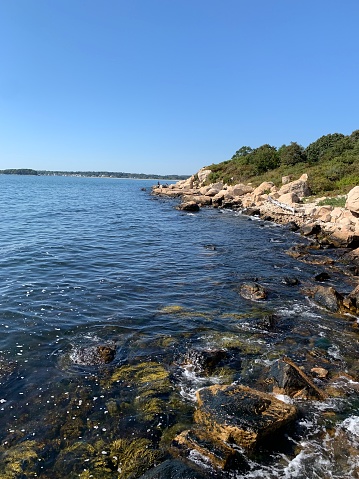 Coastal landscape with rocks & stones at the seashore in Bluff Point Park, Connecticut