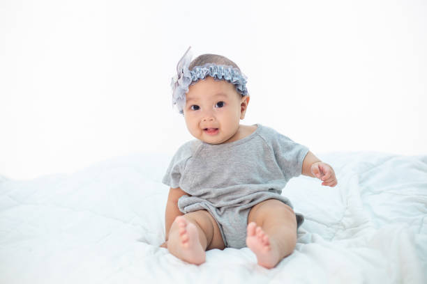 istock The little boy sitting on the bed 1176471212