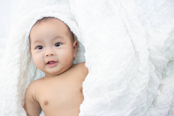 istock The baby is happy on the bed. 1176471579