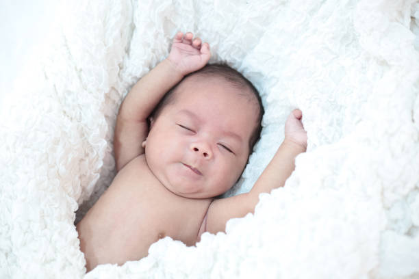 istock The baby sleeps in the bed 1176471627