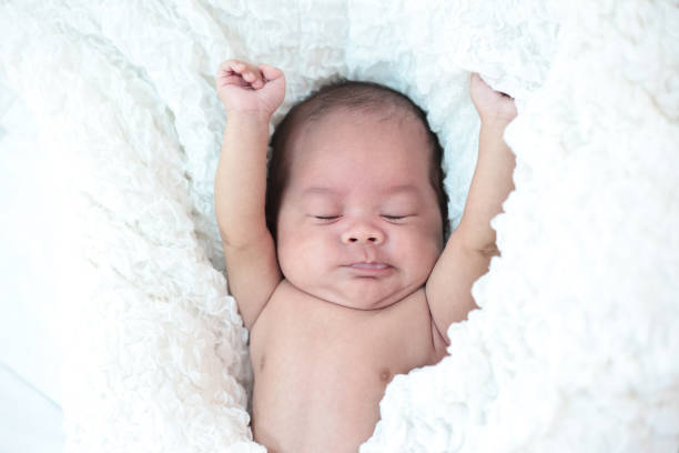 istock The baby sleeps in the bed 1176471639