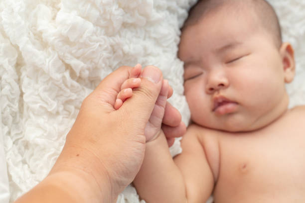 istock New born baby hand,selective focus 1176472292