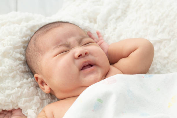 istock Baby lying on the bed 1176472396