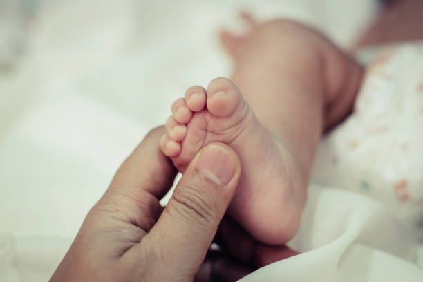 istock New born baby foot,selective focus 1176472398