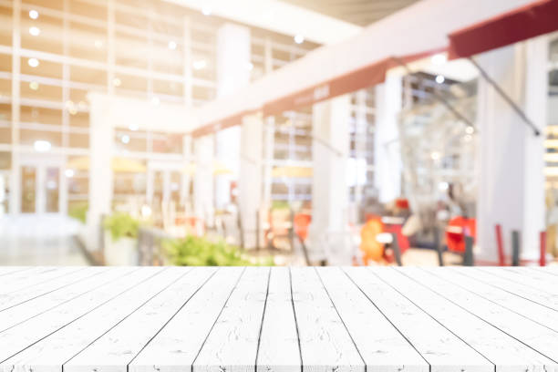 istock Perspective empty white wooden table on top over blur background, can be used mock up for montage products display or design layout. 1176473805