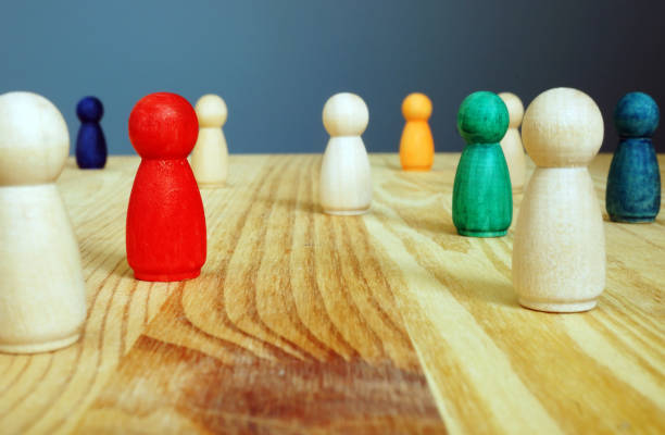 istock Diversity concept. Colored figures between wooden ones. 1176478780
