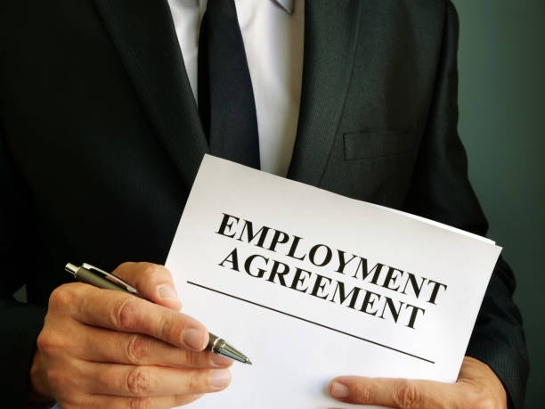 istock Man is holding Employment Agreement and pen. 1176478791