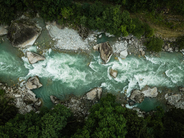 Aerial top view of a splendid mountain river in Swiss Alps Aerial top view of a splendid mountain river in Swiss Alps engelberg photos stock pictures, royalty-free photos & images