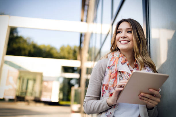 istock Beautiful brunette girl using tablet for work, freelance, blogging, studying, shopping 1176482896