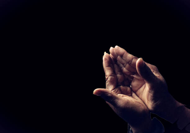 istock Praying hands of  man   . background dark 1176482966