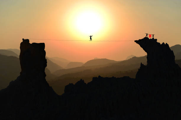 istock slackline sport, successful and challenging team 1176483805