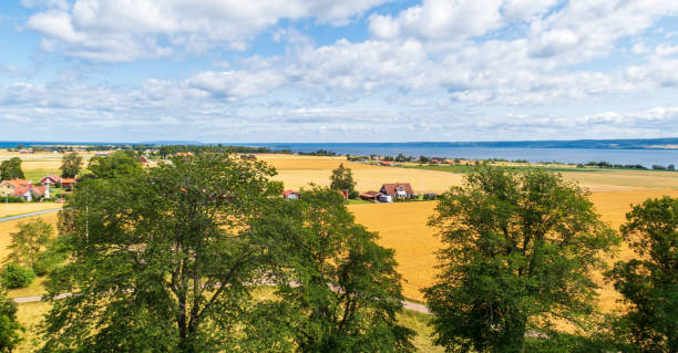 Lake Vattern (Vättern), Jönköping, Sweden, seen from the church tower of Kumlaby, Visingsö - landscape and farmland view in summer Rural landscape on the island Visingsö; high angle view jonkoping stock pictures, royalty-free photos & images