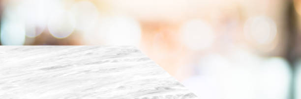 istock marble table top product display background with blur business mall store.left perspective stone  counter hallway.Banner mockup presentation 1176485642