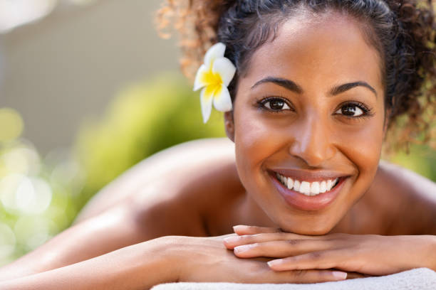 istock Beauty african woman lying on massage table at spa 1176487394