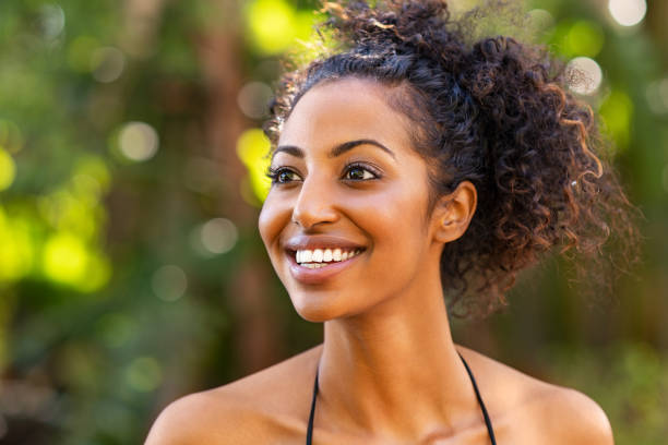 istock Joyful woman in bikini laughing 1176487459