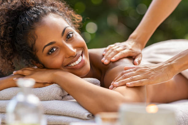 istock Black woman relaxing during spa massage 1176488805