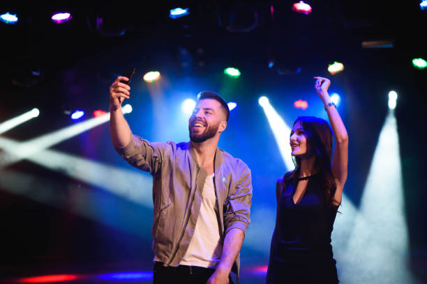 istock Couple take a selfie with a mobile in the night celebration 1176489893
