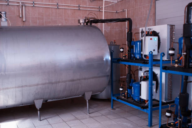 istock Equipment on the farm for processing, storing and cooling cow's milk, producing cow's milk, storage tank for cow milk, charge 1176491301