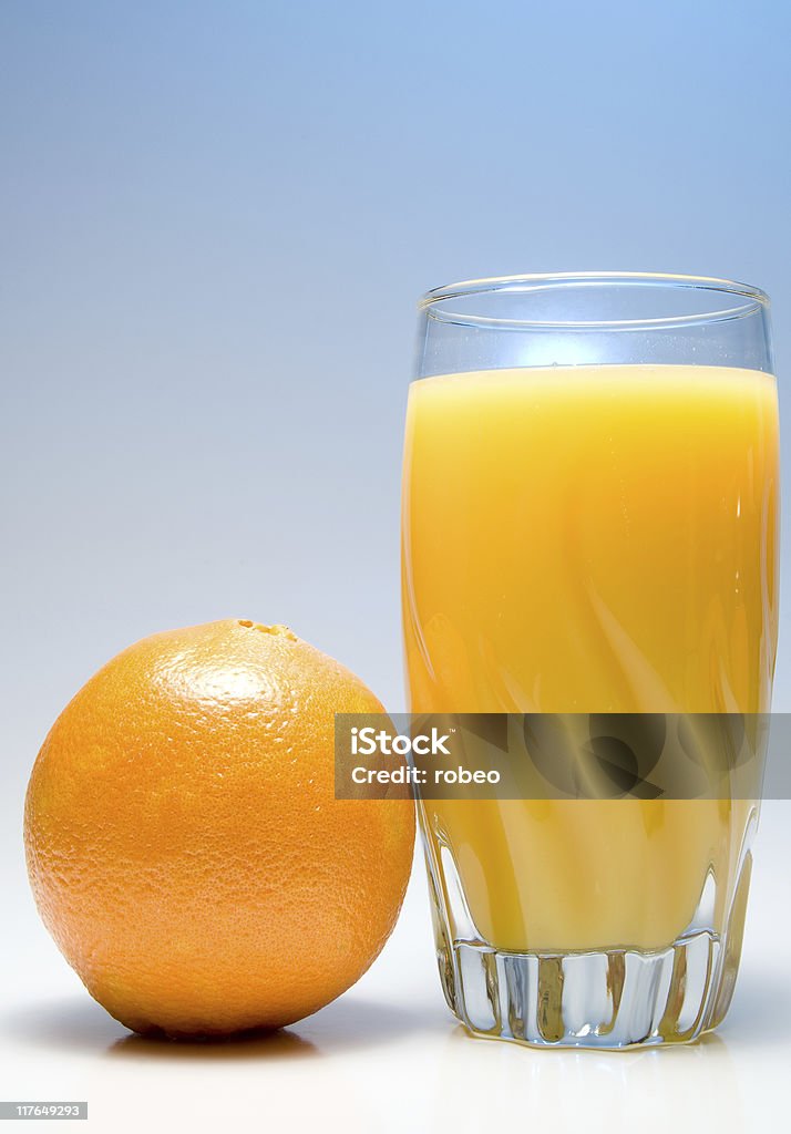 Orange Juice A glass of orange juice with an orange. Breakfast Stock Photo