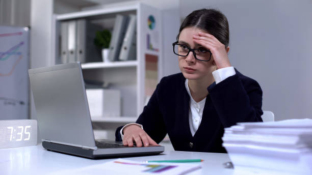 istock Woman annoyed by work on computer suffering headache, depressed at office 1176495821