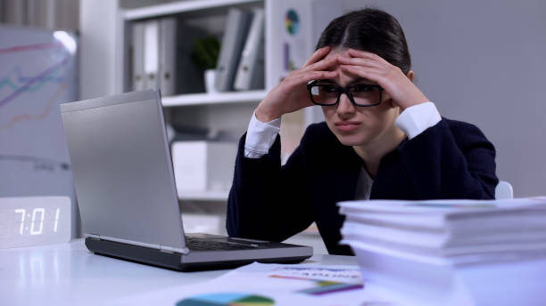 istock Female office employee feeling unhappy about workload, having no time for rest 1176495898