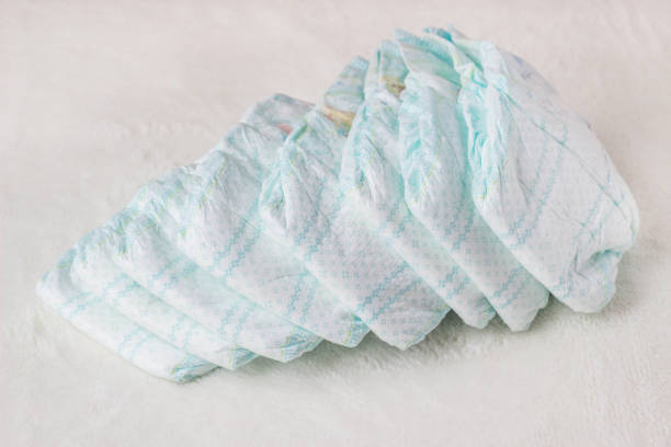 istock Baby diapers on a white background, diapers for babies 1176496043
