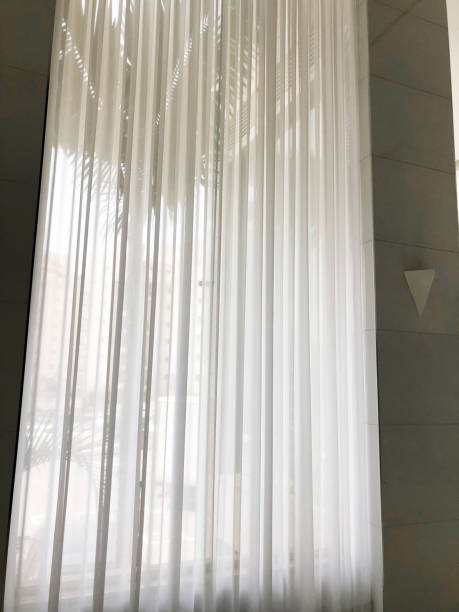 istock white curtains background. Transparent curtain on window. 1176496398