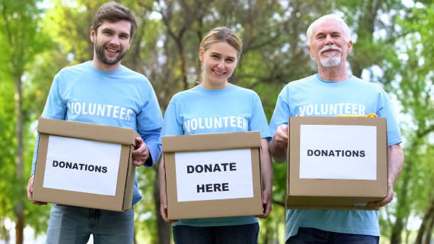 istock Happy volunteers holding donation cardboxes, humanitarian aid assistance project 1176496729