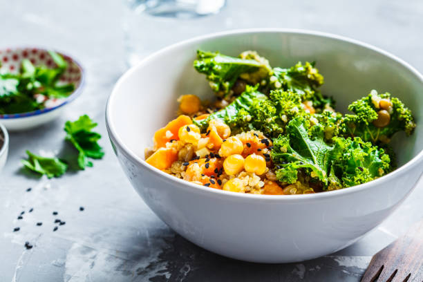 vegan stew with chickpeas, sweet potato and kale in white bowl. - vegetarian salad imagens e fotografias de stock