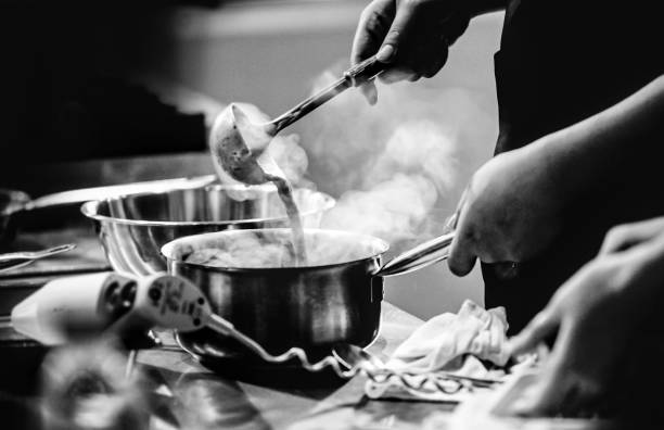 istock chef preparing food, chef cooking in a kitchen, chef at work, Black & White 1176498590