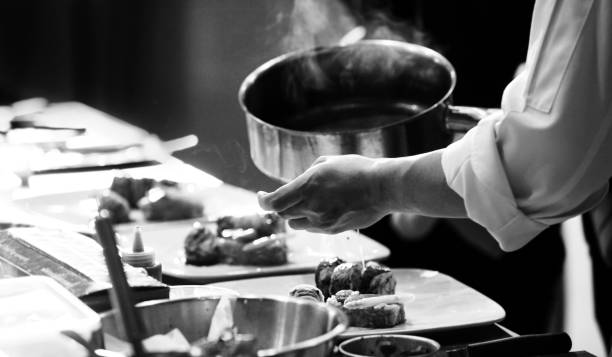 istock chef preparing food, chef cooking in a kitchen, chef at work, Black & White 1176498592