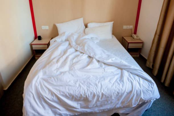 istock White bed in hotel room 1176505551