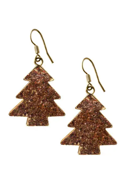 Earrings in the shape of christmas tree isolated over white