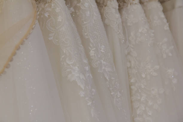 istock Beautiful wedding dresses in a bridal salon 1176507932