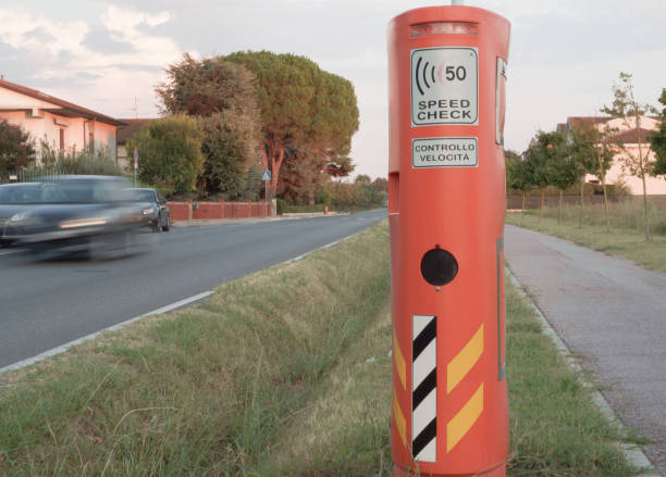 speed camera and car in Italian countryside village stock photo