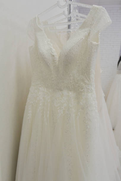 istock Beautiful wedding dresses in a bridal salon 1176508801