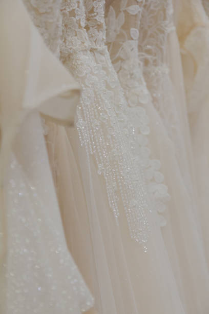 istock Beautiful wedding dresses in a bridal salon 1176508831