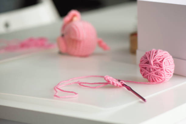 istock Pink yarn ball with woolen thread on white background 1176508860