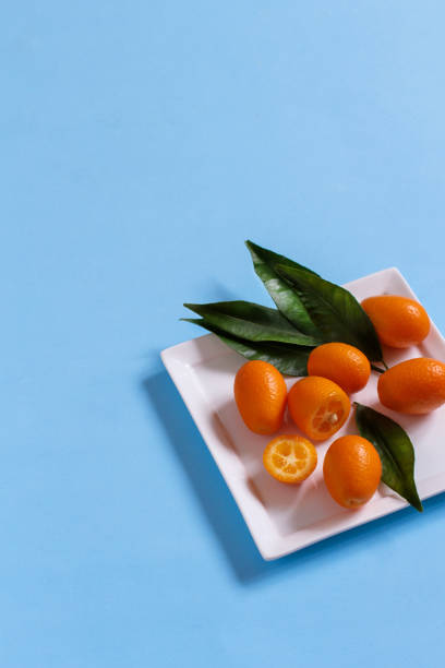 istock Kumquat fruits on a blue background 1176509641