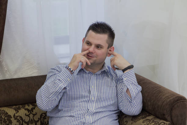 istock Young man sits on a sofa in a wedding salon 1176511034