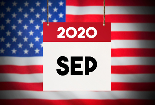 Calendar standing in front of the American flag and showing September 2020 Stock Image