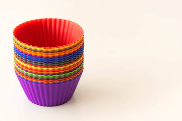 istock Colorful cupcake molds lists placed on top of each other 1176511470