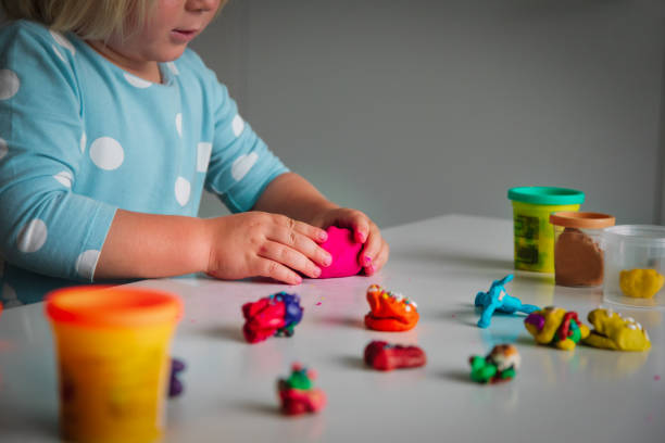 istock Child playing with clay molding shapes, kids crafts 1176512380