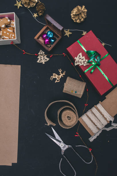 istock Gifts boxes with fir branches on black background top view 1176513004