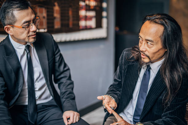 istock Two Chinese businessmen in cafe 1176513006