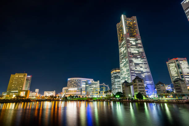 istock city skyline looking up night view in Yokohama 1176514092