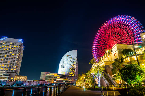 istock city skyline looking up night view in Yokohama 1176514106