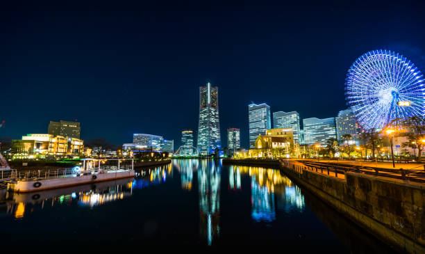 istock city skyline looking up night view in Yokohama 1176514138